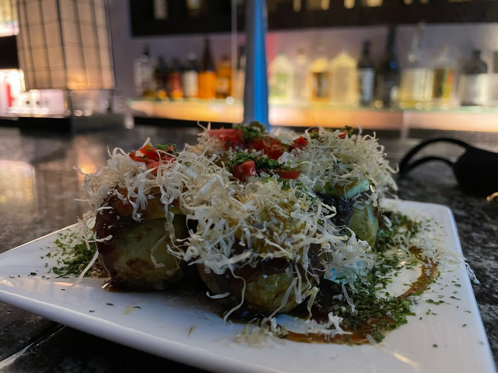 Try the Takoyaki at Murasaki. It’s my favorite dish on the menu!