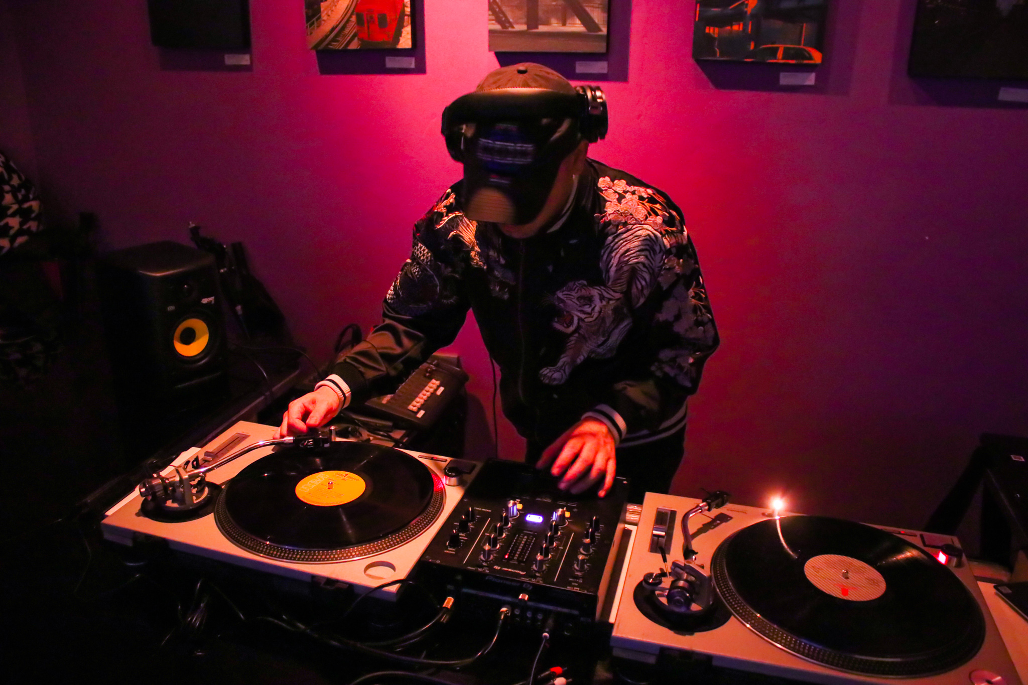 Van Paugam wearing a kitsune mask while DJing with two turntables
